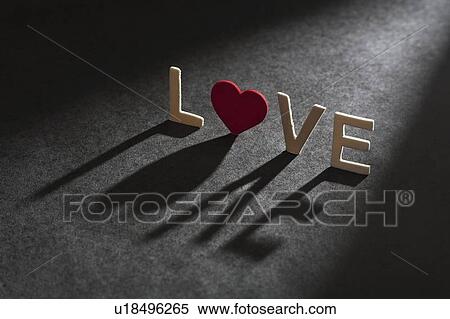 Letters spelling? love casting shado View Large Photo Image Stock Photography - Letters spelling? love casting shado. Fotosearch