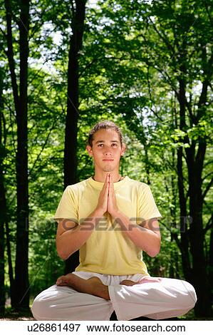 Man meditating in forest View Large Photo Image Stock Photo - Man meditating in forest. Fotosearch