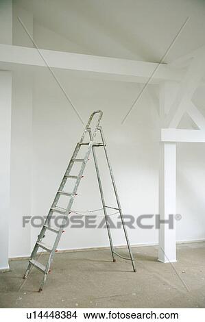 Picture - Metal ladder in empty house. Fotosearch