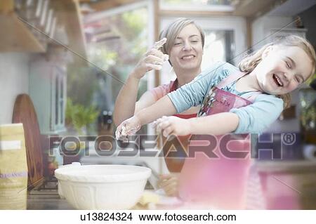 Mother and daughter baking together View Large Photo Image Picture - Mother and daughter baking together. Fotosearch