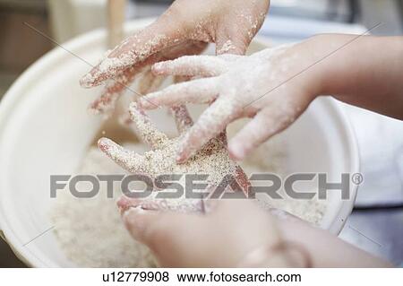 Mother and daughter with sticky hands View Large Photo Image Stock Photo - Mother and daughter with sticky hands. Fotosearch