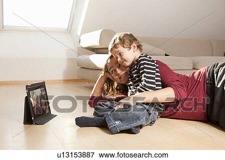 Mother and son video chatting View Large Photo Image Stock Photo - Mother and son video chatting. Fotosearch