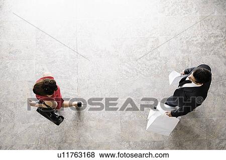Overhead view of business people walking View Large Photo Image Stock Photo - Overhead view of business people walking. Fotosearch