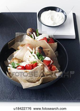 Stock Photograph - Plate of chicken pita sandwiches. Fotosearch
