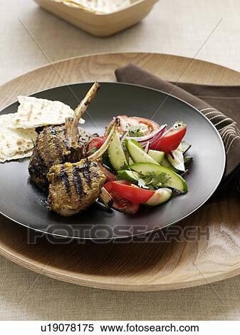 Stock Photography - Plate of lamb with vegetables. Fotosearch