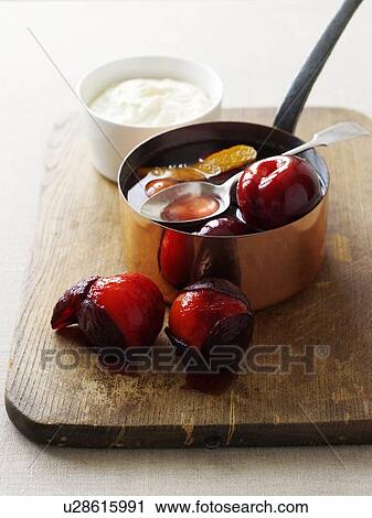 Pot of stewed plums on board View Large Photo Image Stock Image - Pot of stewed plums on board. Fotosearch