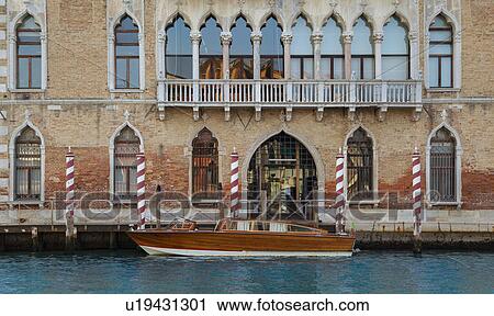 Rowboat and building on urban canal View Large Photo Image Stock Image - Rowboat and building on urban canal. Fotosearch