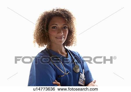 Stock Photograph - Smiling doctor wearing stethoscope. Fotosearch