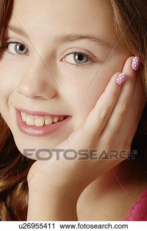 Smiling girl resting chin in hand View Large Photo Image Stock Image - Smiling girl resting chin in hand. Fotosearch