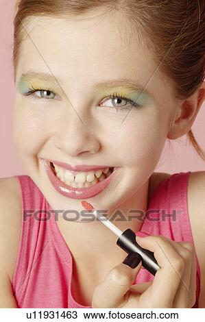 Smiling girl wearing colorful makeup View Large Photo Image Stock Image - Smiling girl wearing colorful makeup. Fotosearch