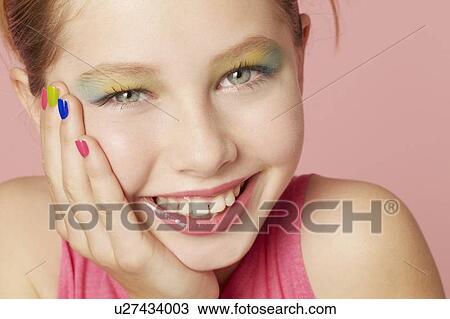 Smiling girl wearing colorful makeup View Large Photo Image Stock Image - Smiling girl wearing colorful makeup. Fotosearch