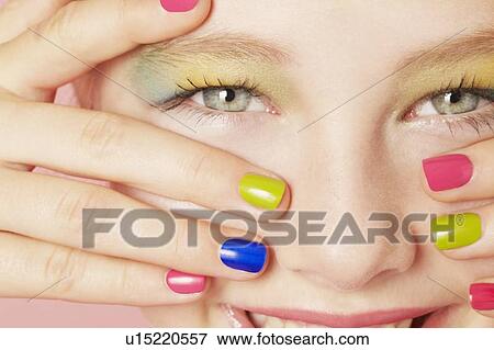 Smiling girl wearing colorful makeup View Large Photo Image Stock Photo - Smiling girl wearing colorful makeup. Fotosearch