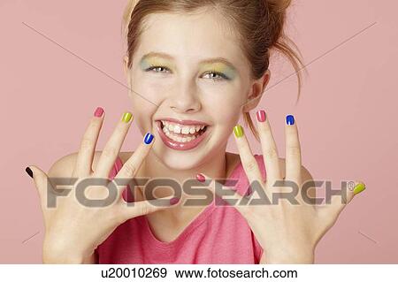 Smiling girl wearing colorful makeup View Large Photo Image Stock Photo - Smiling girl wearing colorful makeup. Fotosearch
