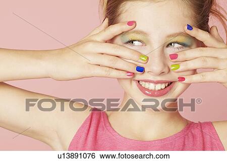 Smiling girl wearing colorful makeup View Large Photo Image Stock Photograph - Smiling girl wearing colorful makeup. Fotosearch