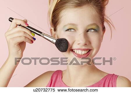 Smiling girl wearing colorful makeup View Large Photo Image Stock Photography - Smiling girl wearing colorful makeup. Fotosearch
