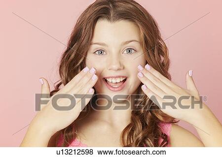 Stock Photo - Smiling girl with polka dot manicure. Fotosearch