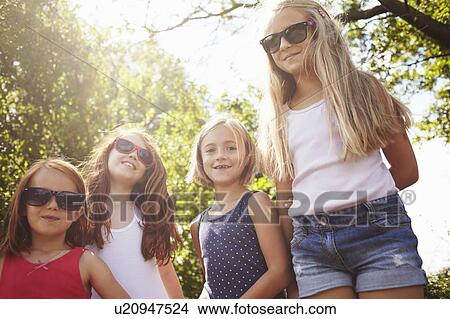 Smiling girls standing outdoors View Large Photo Image Picture - Smiling girls standing outdoors. Fotosearch