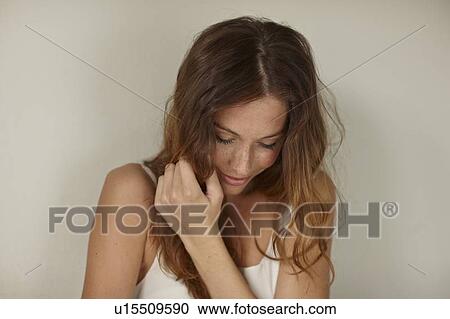 Smiling woman sitting indoors View Large Photo Image Stock Image - Smiling woman sitting indoors. Fotosearch