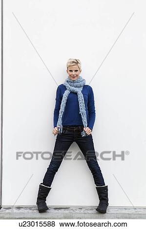 Stock Photo - Smiling woman standing outdoors. Fotosearch