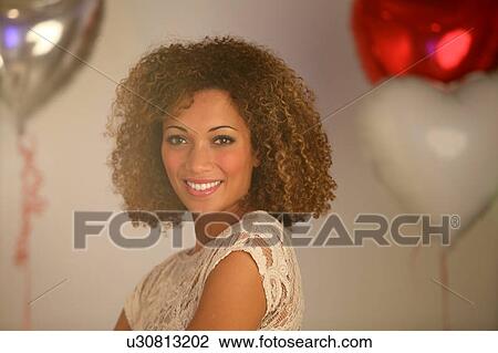 Smiling woman wearing lace View Large Photo Image Stock Image - Smiling woman wearing lace. Fotosearch