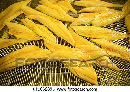 Smoked fish on rack in factory View Large Photo Image Stock Photography - Smoked fish on rack in factory. Fotosearch