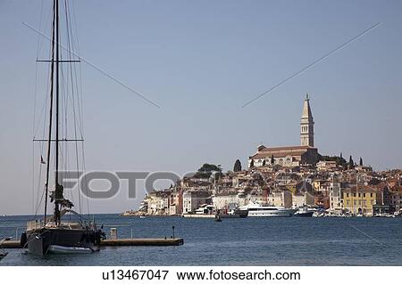 Stock Photo - Tower over village and waterfront. Fotosearch