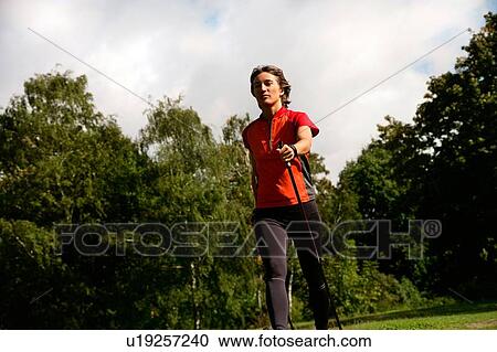 Woman hiking in park View Large Photo Image Stock Image - Woman hiking in park. Fotosearch