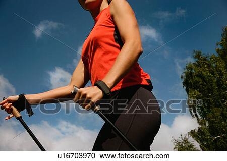 Woman hiking in rural landscape View Large Photo Image Stock Image - Woman hiking in rural landscape. Fotosearch