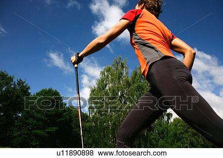 Woman hiking in rural landscape View Large Photo Image Stock Photo - Woman hiking in rural landscape. Fotosearch