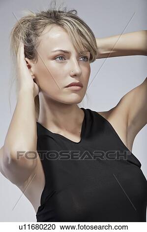 Woman holding her head View Large Photo Image Stock Image - Woman holding her head. Fotosearch