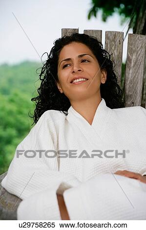 Woman in bathrobe sitting outdoors View Large Photo Image Stock Photography - Woman in bathrobe sitting outdoors. Fotosearch
