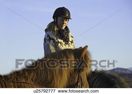 Woman riding horse outdoors View Large Photo Image Stock Photo - Woman riding horse outdoors. Fotosearch