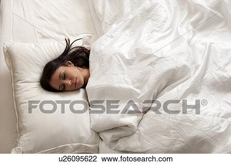 Woman sleeping in bed View Large Photo Image Stock Image - Woman sleeping in bed. Fotosearch