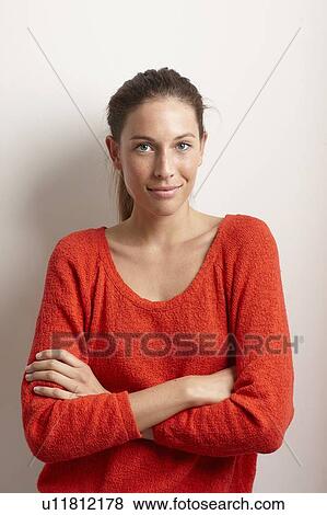 Woman standing with arms crossed View Large Photo Image Stock Photo - Woman standing with arms crossed. Fotosearch