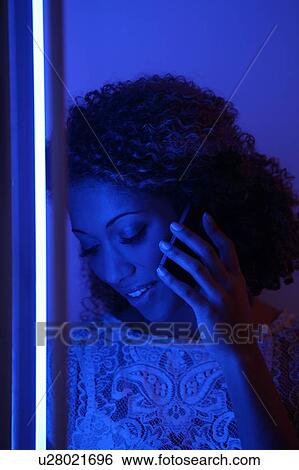 Woman talking on cell phone View Large Photo Image Stock Photograph - Woman talking on cell phone. Fotosearch