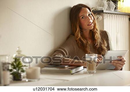 Picture - Woman using tablet computer. Fotosearch