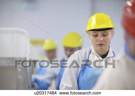 Workers on line at factory View Large Photo Image Picture - Workers on line at factory. Fotosearch