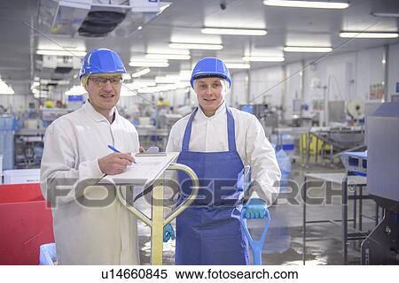 Workers talking in factory View Large Photo Image Stock Photography - Workers talking in factory. Fotosearch