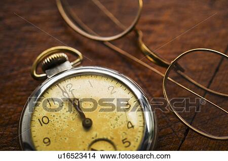 Picture - Antique clock and glasses. Fotosearch