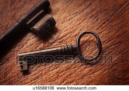 Stock Photograph - Antique keys on wood. Fotosearch