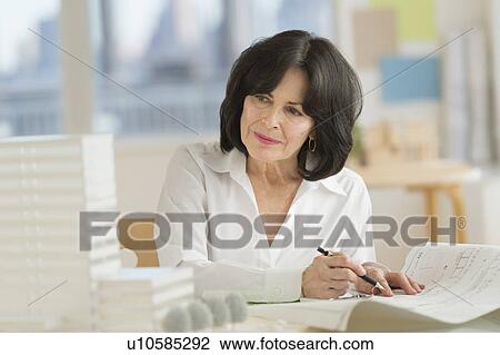 Stock Image - Architect during work. Fotosearch