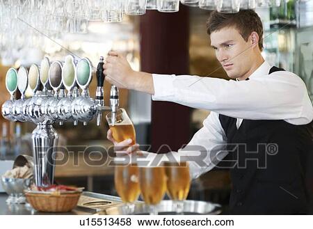 Bartender pouring beer View Large Photo Image Stock Photo - Bartender pouring beer. Fotosearch