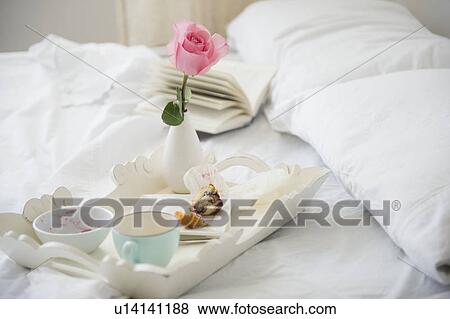 Stock Photo - Breakfast plate on bed. Fotosearch