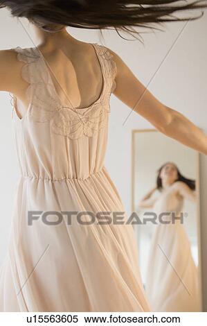 Bride trying on wedding dress View Large Photo Image Stock Photography - Bride trying on wedding dress. Fotosearch