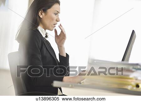 Stock Photography - Businesswoman using computer. Fotosearch
