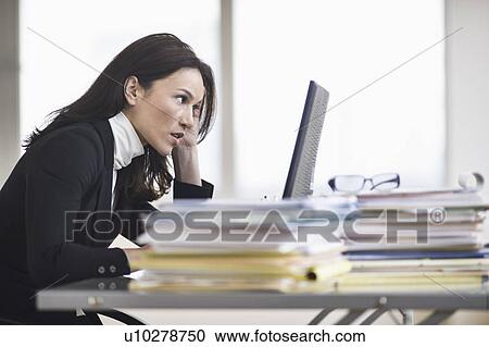 Businesswoman working in office View Large Photo Image Stock Image - Businesswoman working in office. Fotosearch