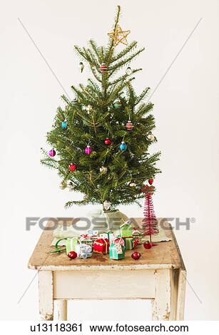 Stock Image - Christmas tree on old table. Fotosearch
