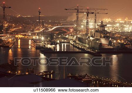 Cityscape with cranes at night View Large Photo Image Stock Photograph - Cityscape with cranes at night. Fotosearch