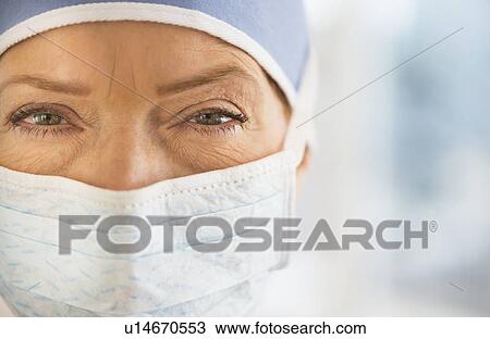 Stock Image - Close-up of female surgeon. Fotosearch