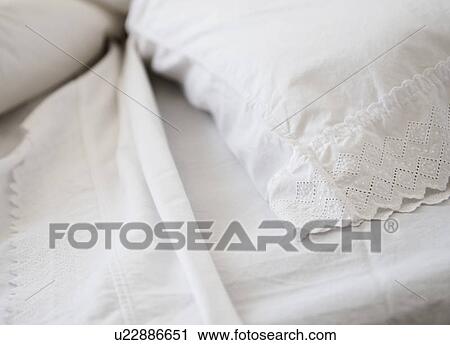 Stock Image - Close-up of lace bedclothes. Fotosearch